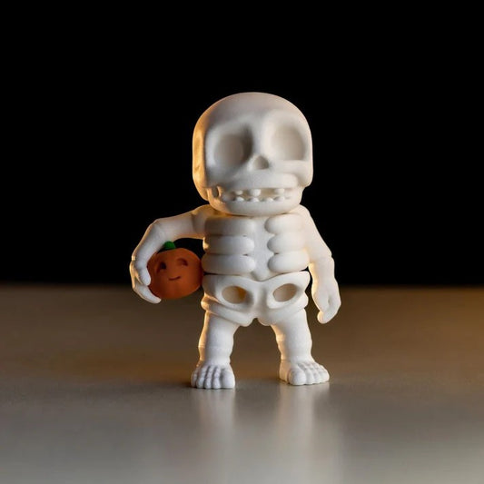 Tiny Skeleton holding pumpkin